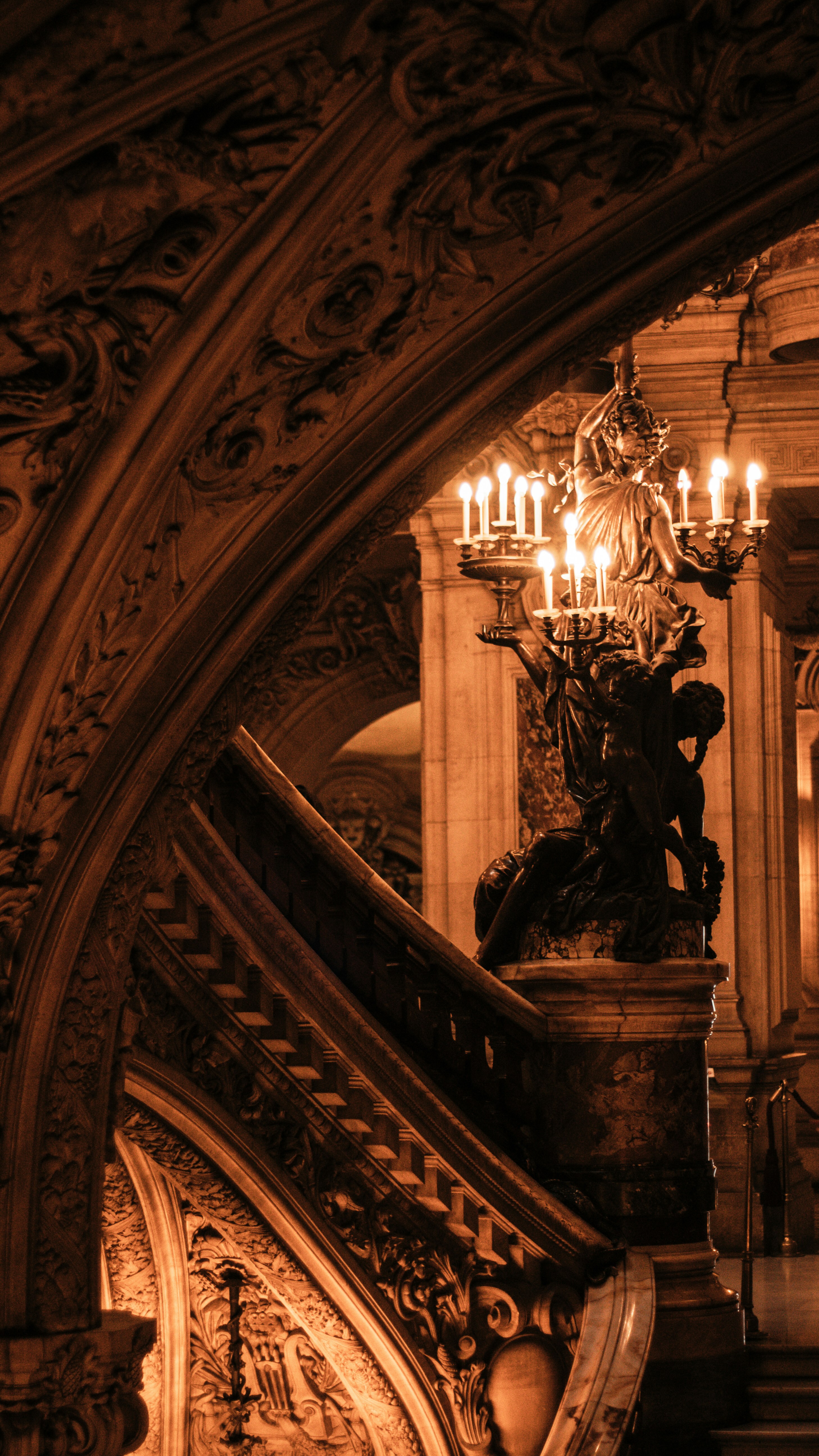 Palais Garnier interior, candlelight on gilded sculpture — bespoke Paris itinerary planning and private concierge